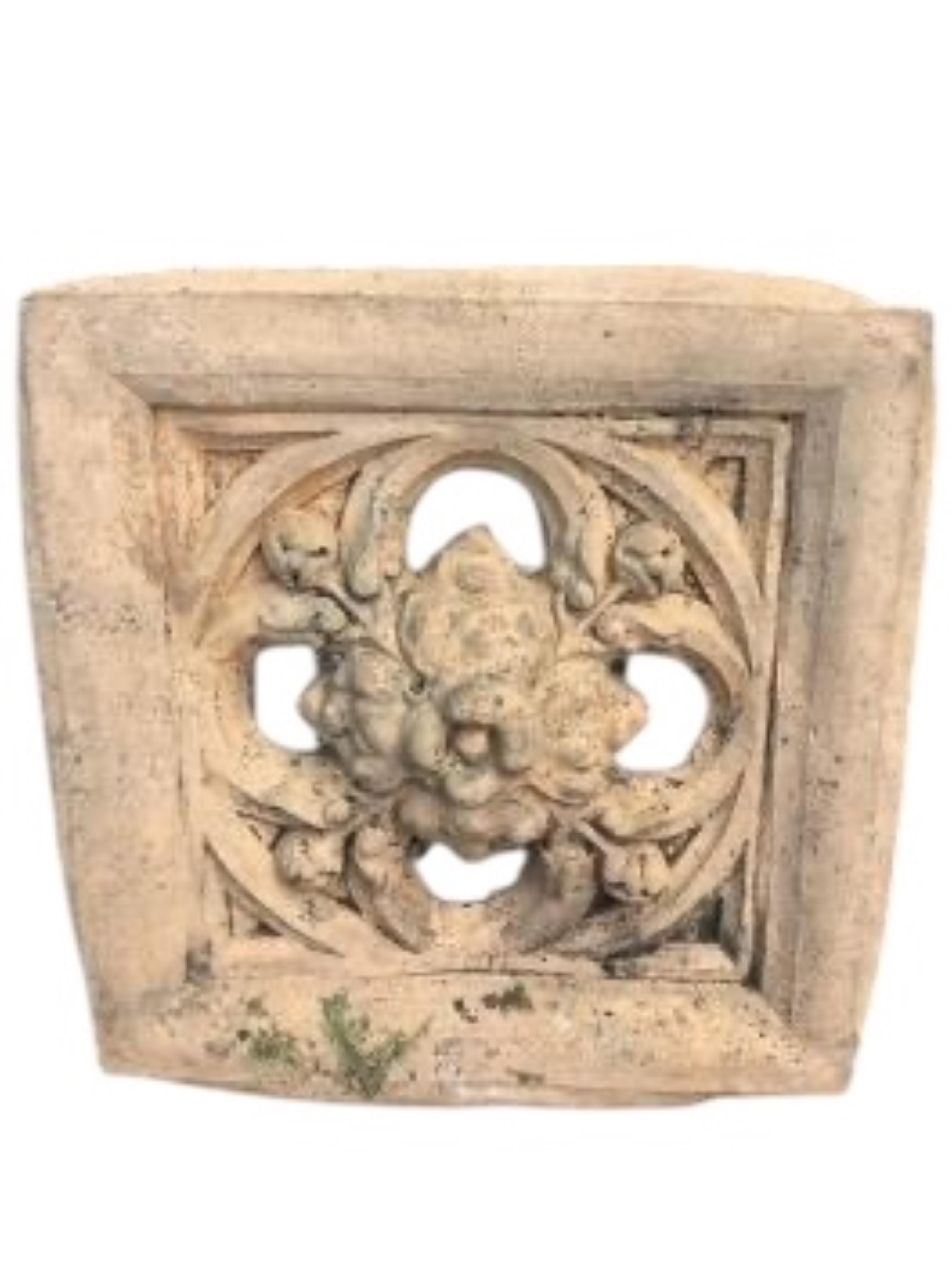 A Gothic style cast stone garden wall plaque and a terracotta tile, larger width 56cm, height 58cm